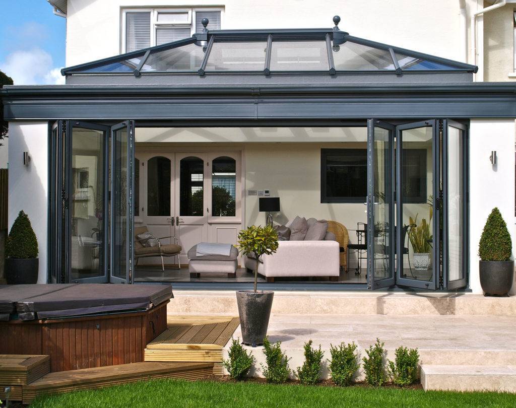bifolddoors Bi-fold doors on the front of the conservatory of a beautiful house