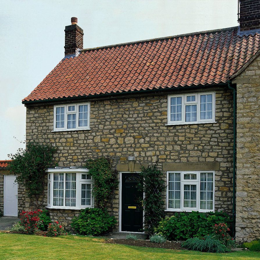 a house with multiple casement windows