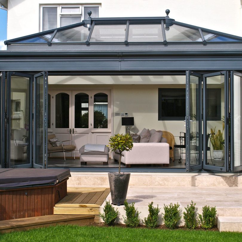 Bi-fold doors on the front of conservatory of beautiful house