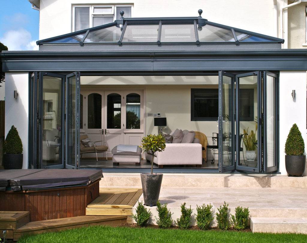 bifolddoors Bi-fold doors on the front of conservatory of beautiful house