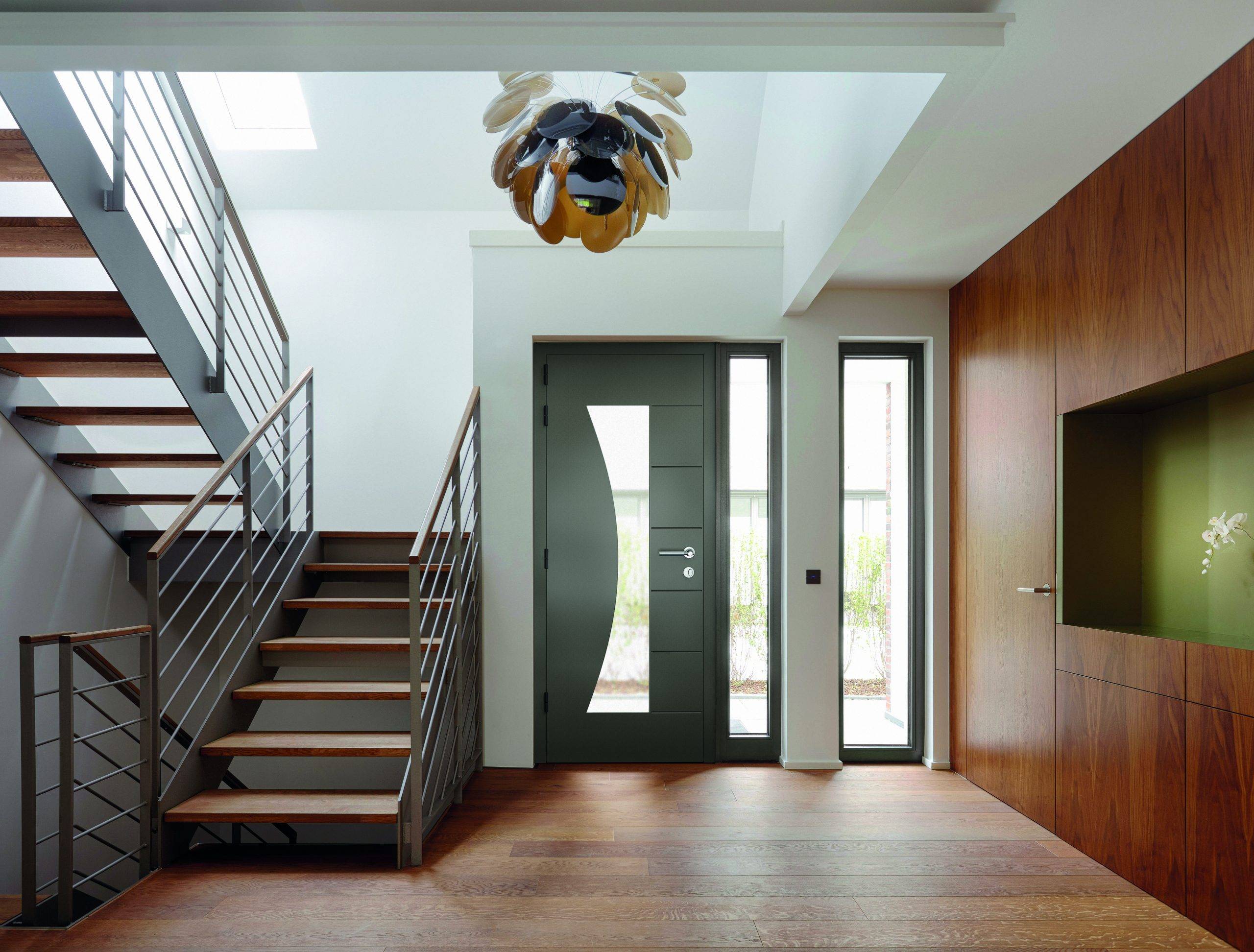 Plank floor and walnut wall covering in home near staircase aluminium residential door prices essex