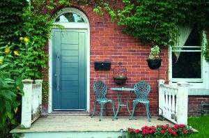 Red outside door with a patio and seating aluminium door prices near me